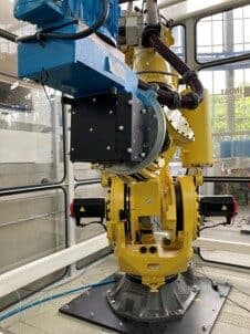 FANUC robot with ART target on the actuator (from Uhlmann et al., see below)